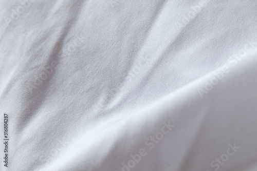 Wrinkled White grey fabric close up shot of good quality Cotton and polyester shirt. formal wear for office worker . Background texture concept with copy space for text.