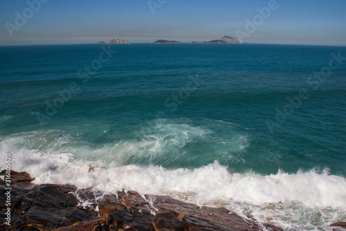  famous party paradise beach with mountain views right in the heart of the city - Ipanema. The turquoise waters of the Atlantic Ocean in Latin America. photo