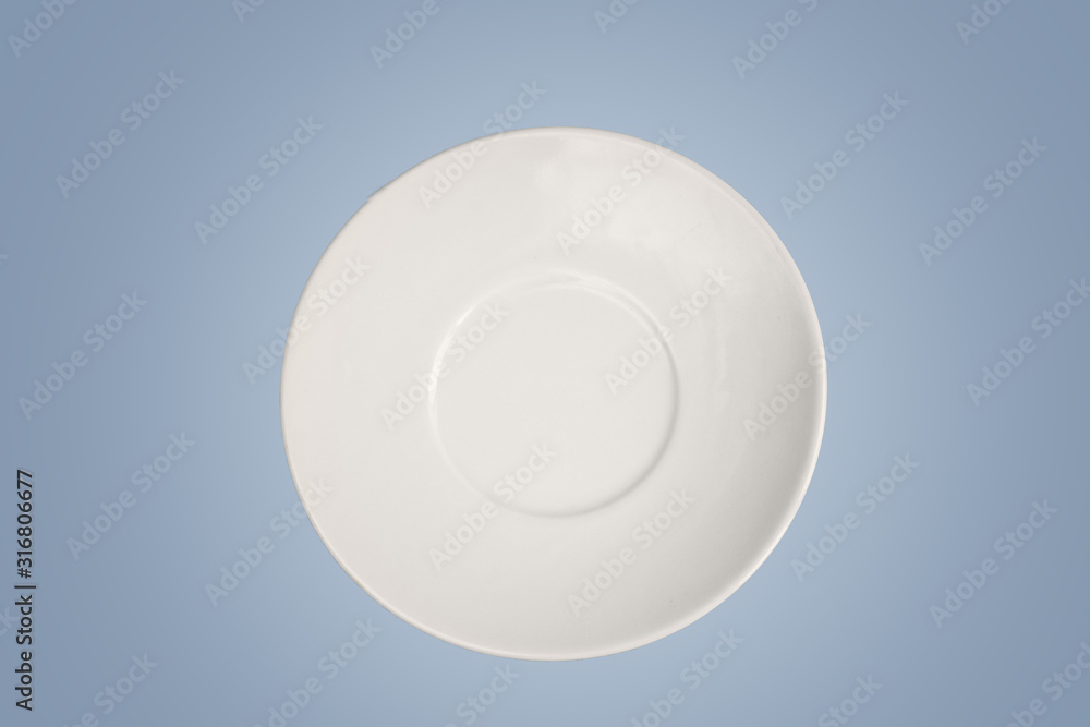 white empty saucer isolated on light blue background with empty space for text. Minimalism concept white empty saucer isolated on light blue background with empty space for text. Minimalism concept