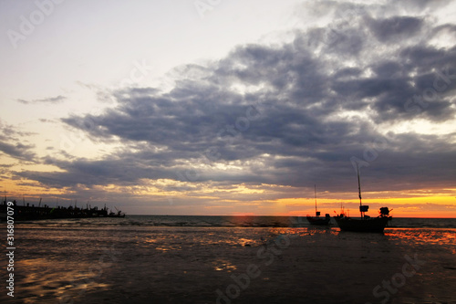 Fishing boat and blurred cloud background