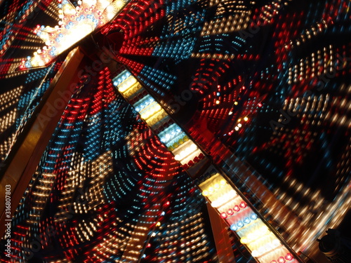 neon light abstract photo. long exposure photo of a Ferris wheel in the night