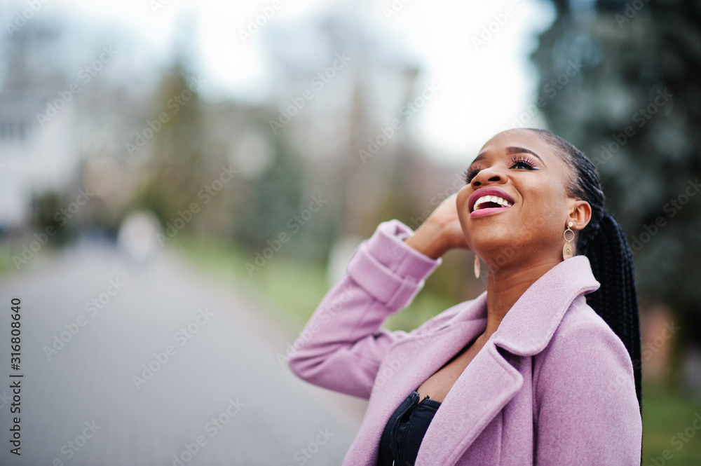 Young stylish beautiful african american woman in street, wearing fashion outfit coat. Young stylish beautiful african american woman in street, wearing fashion outfit coat.