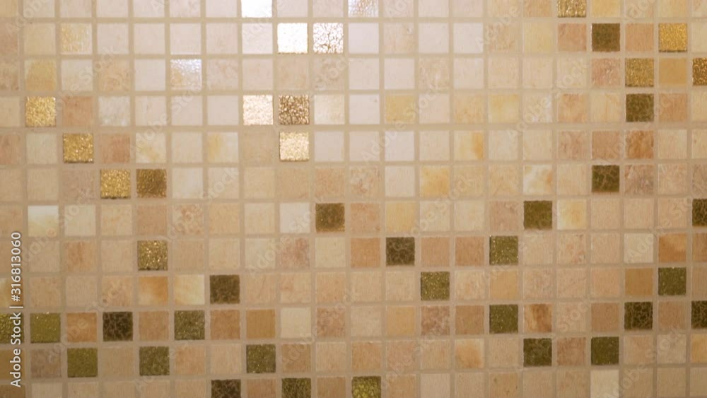 Beautiful mosaic tiles in beige and brown tones in a modern interior in the kitchen and bathroom, interior decoration Beautiful mosaic tiles in beige and brown tones in a modern interior in the kitchen and bathroom, interior decoration