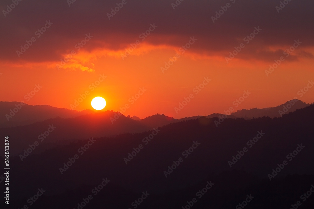 Sunset in the mountains at Thailand.