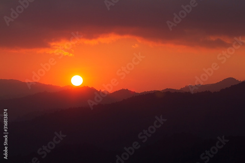 Sunset in the mountains at Thailand. © AOW