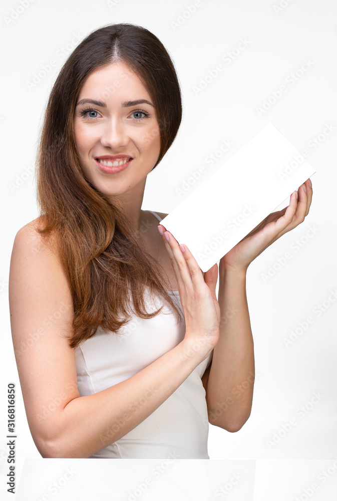 Vertical photo of a woman with blue eyes holding a white box Vertical photo of a woman with blue eyes holding a white box