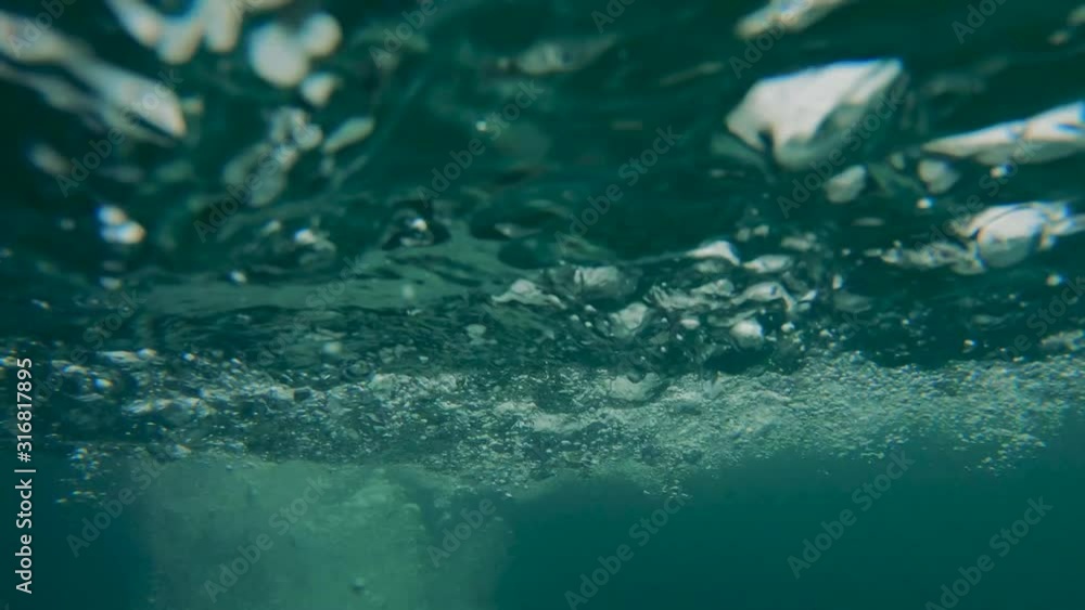 Male experts are inspecting metal tile moving along the transporter