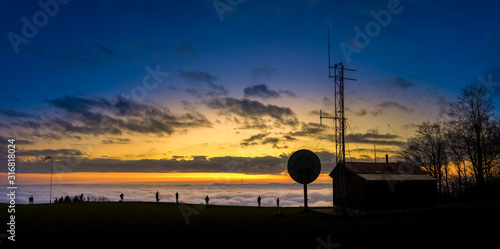 Amazing sunset sunrise inversion night view of the transmitter with lookout on the top mountain Kozakov. Czech Republic. photo