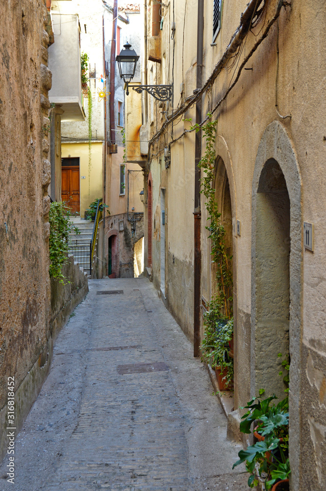 Castelcivita, Italy. A narrow street between the old houses of a medieval village