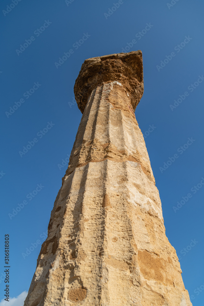 Ruined Temple of Heracles columns in famous ancient Valley of Temples in Agrigento, Sicily, Italy.