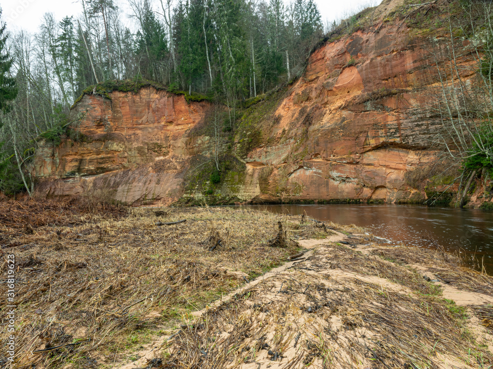 landscape with sandstone cliff and river landscape with sandstone cliff and river