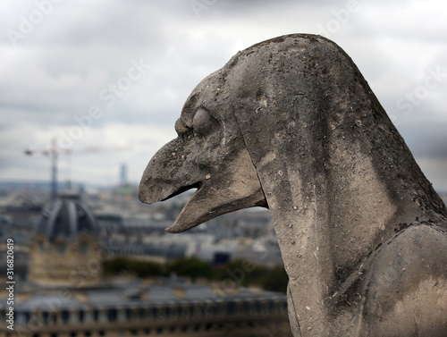 statue on the cathedral of Notre Dame in Paris France