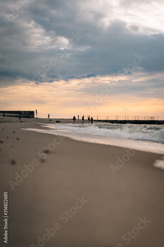 Late summer sunset on the Baltic sea coastline. Landscape of a beach near Ustka  Poland.