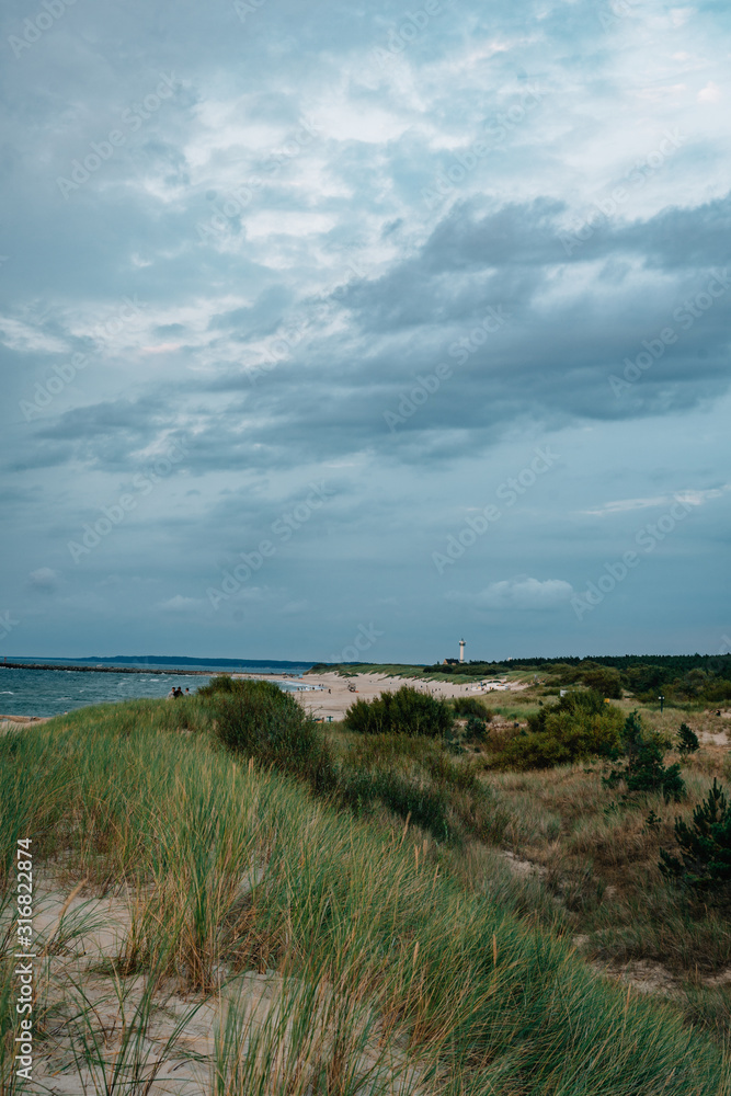 Late summer sunset on the Baltic sea coastline. Landscape of a beach near Ustka, Poland. Late summer sunset on the Baltic sea coastline. Landscape of a beach near Ustka, Poland.