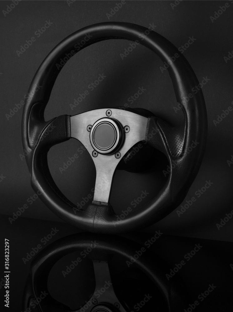 Steering wheel isolated on black