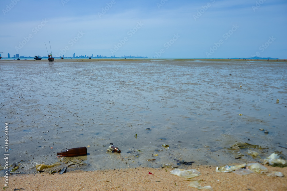 Low tide at noon, sunny at the Thai sea, north of Pattaya.