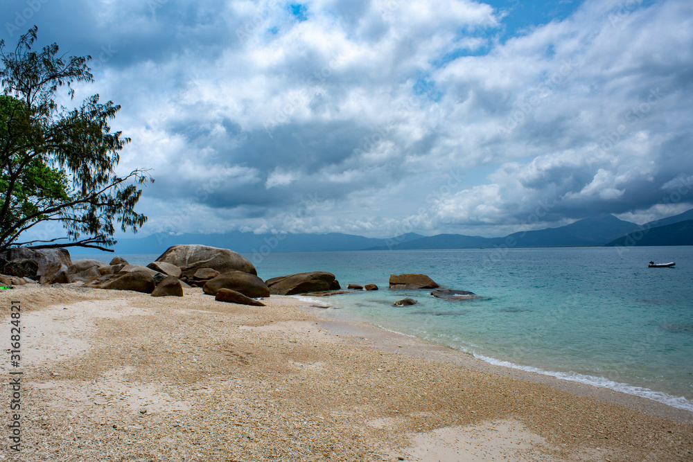 Nudey Beach on Fitzroy Island Part of the Great Barrier Reef In Far North Queensland Australia. Nudey Beach on Fitzroy Island Part of the Great Barrier Reef In Far North Queensland Australia.