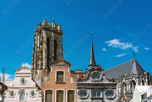 houses on square called Grote Markt and tower of St. Rumbold's Cathedral  in Mechelen, Belgium photo