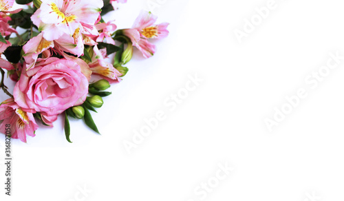 Festive flower arrangement. Pink flowers on white background - roses and astromeria. Background for greetings, invitations, and postcards. photo