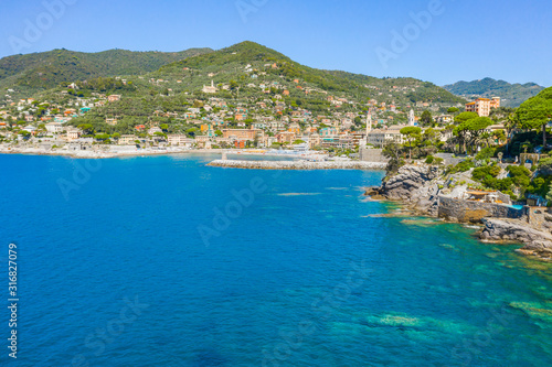 Fototapeta Naklejka Na Ścianę i Meble -  Rocky bay in Camogli, Italy. Aerial view on Adriatic seaside, liguria.