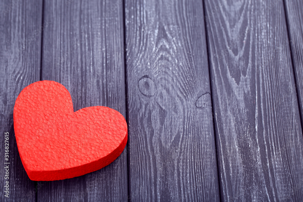 Valentine heart on black wooden background Valentine heart on black wooden background