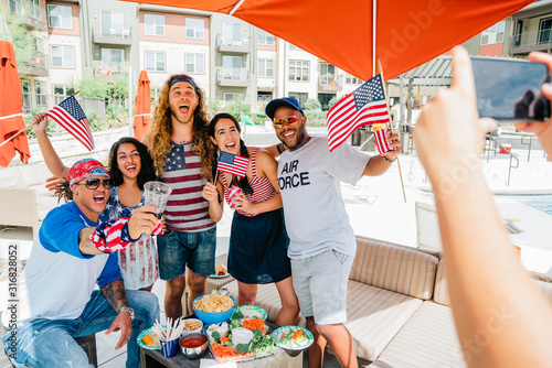 Air Force Veteran and friends having a 4th of July BBQ party at apartment complex. 