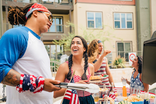 Air Force Veteran and friends having a 4th of July BBQ party at apartment complex. 