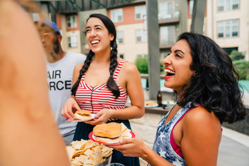 Air Force Veteran and friends having a 4th of July BBQ party at apartment complex. 