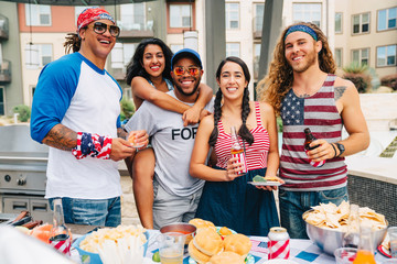 Air Force Veteran and friends having a 4th of July BBQ party at apartment complex. 