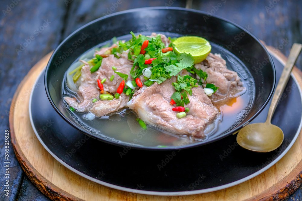 Spicy pork soup serving in restaurant Spicy pork soup serving in restaurant