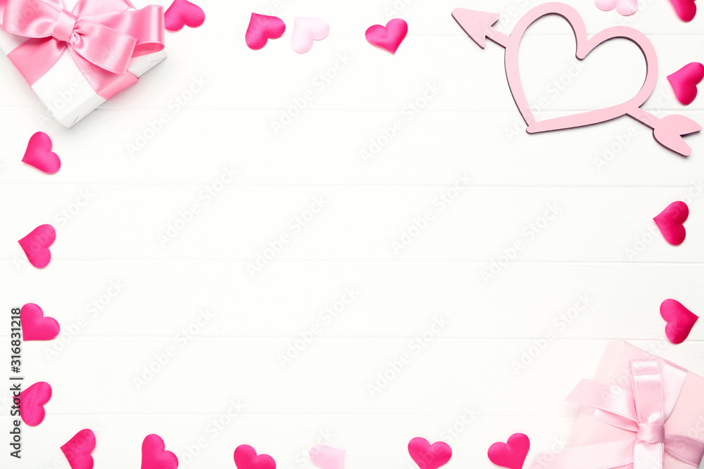 Gift boxes with ribbons and hearts on white wooden table Gift boxes with ribbons and hearts on white wooden table