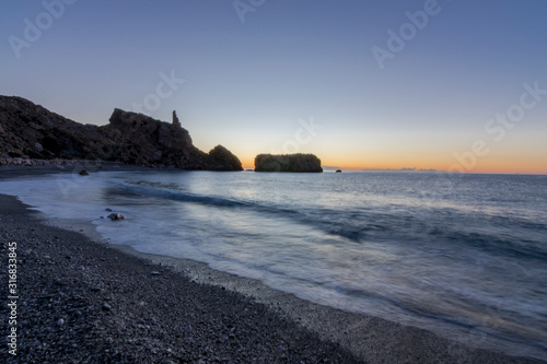 sunset on coast of sea