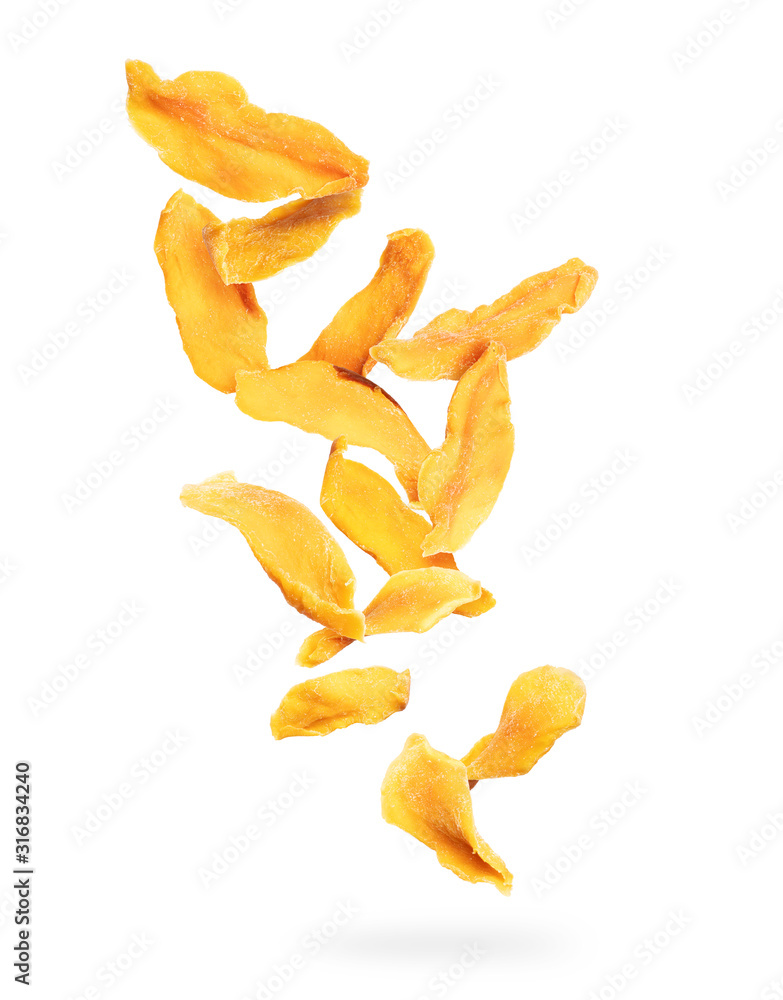 Dried chopped mango slices falling down on a white background Dried chopped mango slices falling down on a white background