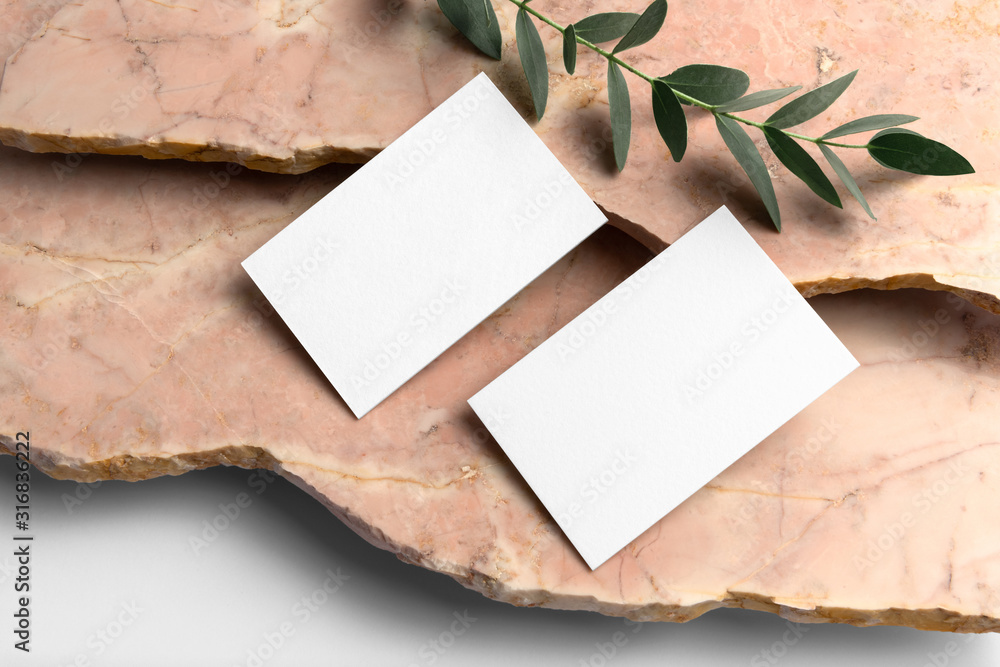Real photo, business cards branding mockup template, isolated on light grey background, with marble and floral elements to place your design. - obrazy, fototapety, plakaty 