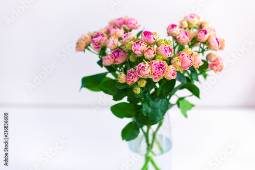 Bouquet of pink spray peony roses in vase. © rosinka79