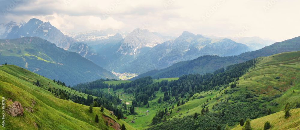 View of mountains and Canazei village from Sella pass, Dolomites Alps, Italy, Europe