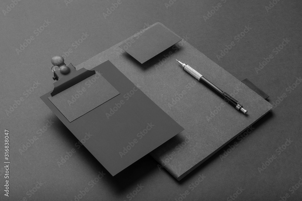 Real photo, black stationery branding mockup template, on black background to place your design. - obrazy, fototapety, plakaty 