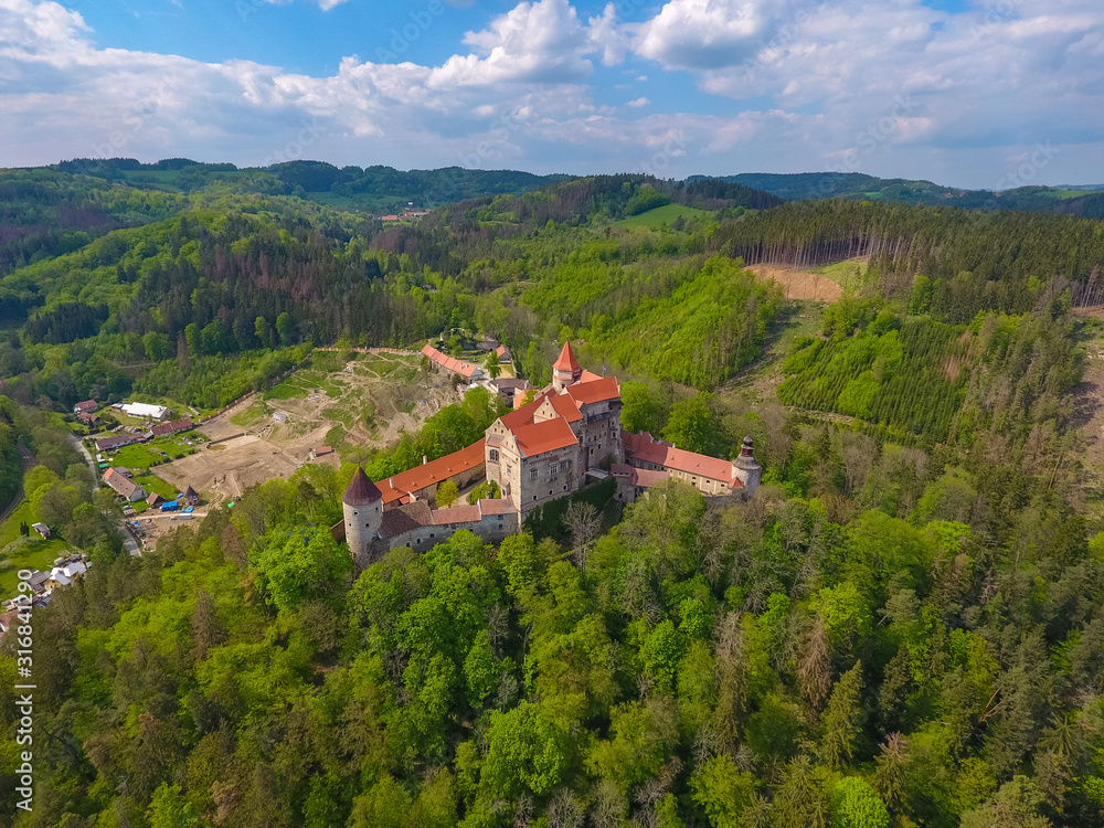 Aerial view of Moravian castle Pernstejn, standing on a hill above deep forests of the Bohemian-Moravian Highlands in Czech Republic