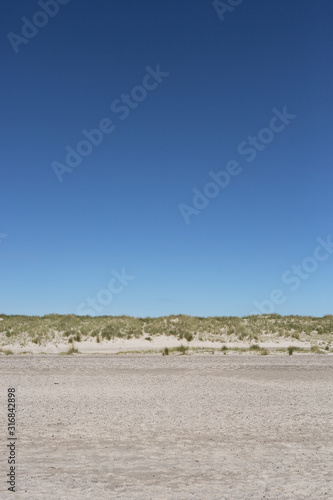 Perfect beach with sanddunes and blue sky