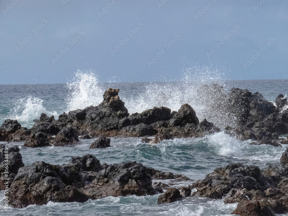 Pacific waves crashing on the rocks