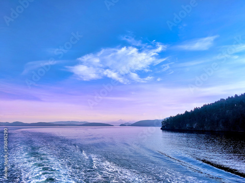 Waves quaking behind a ferry making its way through the San Juan Islands photo