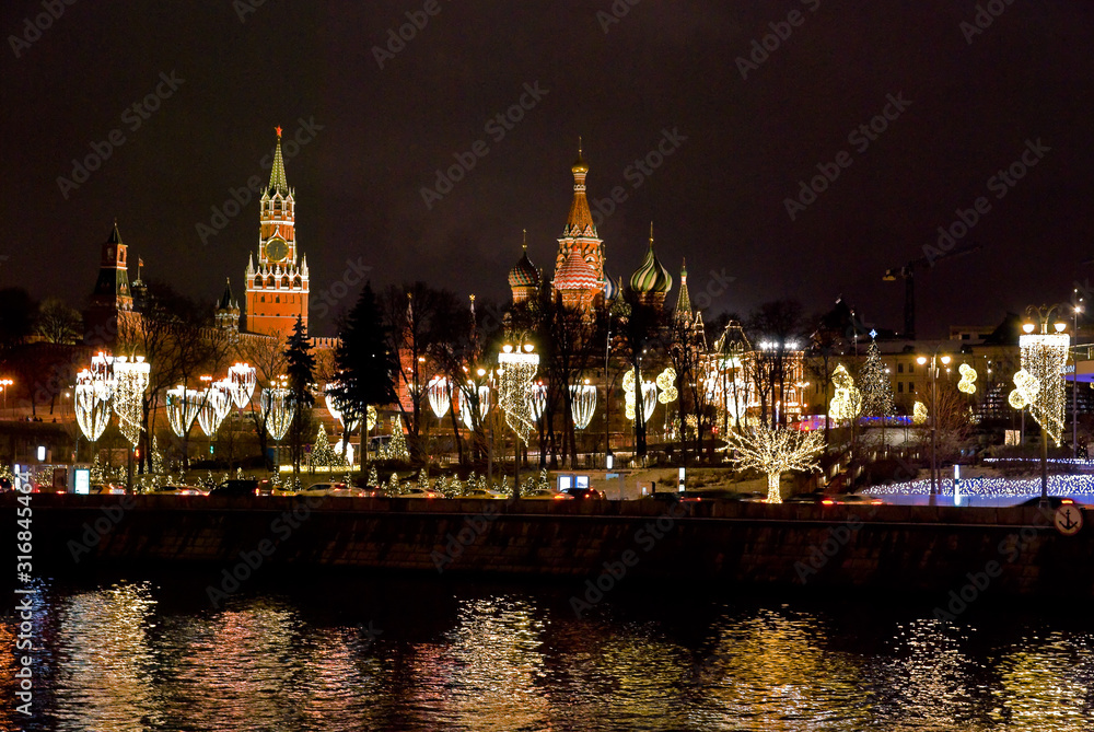 View of the Kremlin from Raushskaya embankment on a winter evening