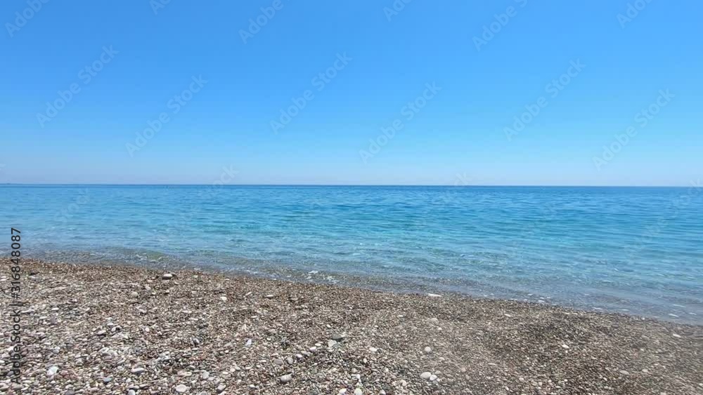 Turtle beach with clear water and mountains in background Turtle beach with clear water and mountains in background