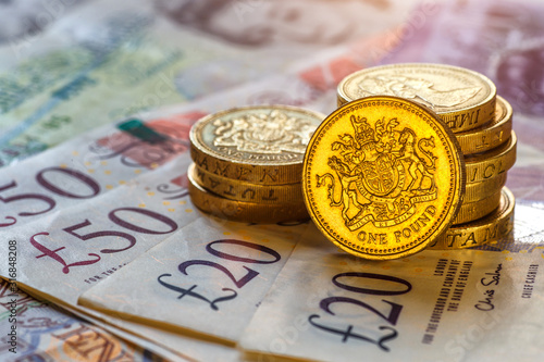 British coins stack on black, pound sterling,Business concept photo