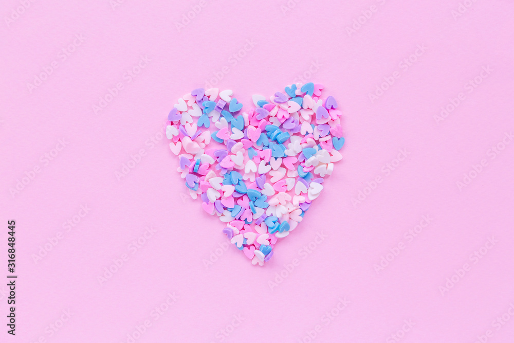 Big heart consists from many small hearts on pink background with copy space for text or congratulations. Love or holiday concept .