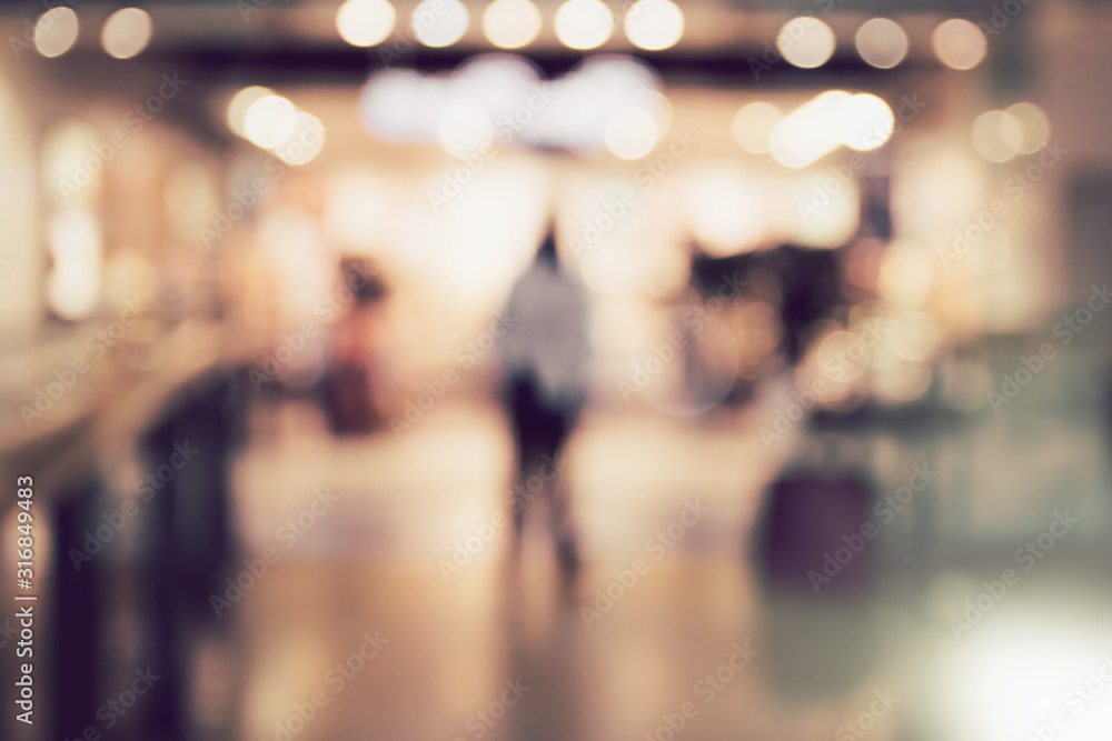 Abstract blurred and defocused background of shopping mall with bokeh. Sales concept.