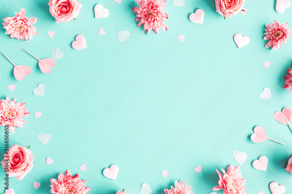 Valentine\'s Day background. Pink flowers, hearts on pastel blue ...