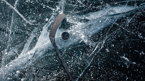 фотографія Details close up hockey puck on a frozen pond