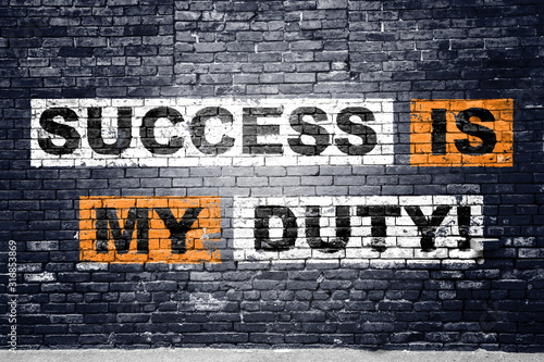Success is my duty! saying lettering Graffiti on Brick Wall