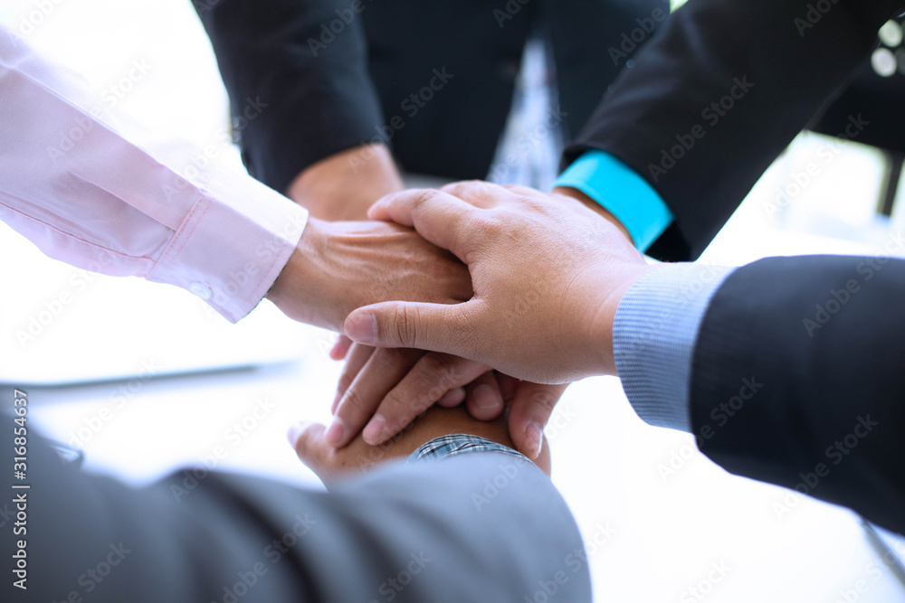 Obraz premium Power of cooperation in the construction business.To succeed in developing sustainable partnerships.